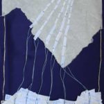 Mixed media collage of a mountain made from paper and thread, against dark blue background