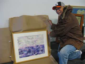 Bill with unwrapped, framed watercolor painting