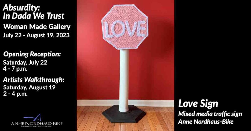 Pink crocheted Love Sign mounted on traffic sign stand with black base - mixed media art by Chicago artist Anne Nordhaus-Bike for Absurdity: In Dada We Trust exhibition at Woman Made Gallery
